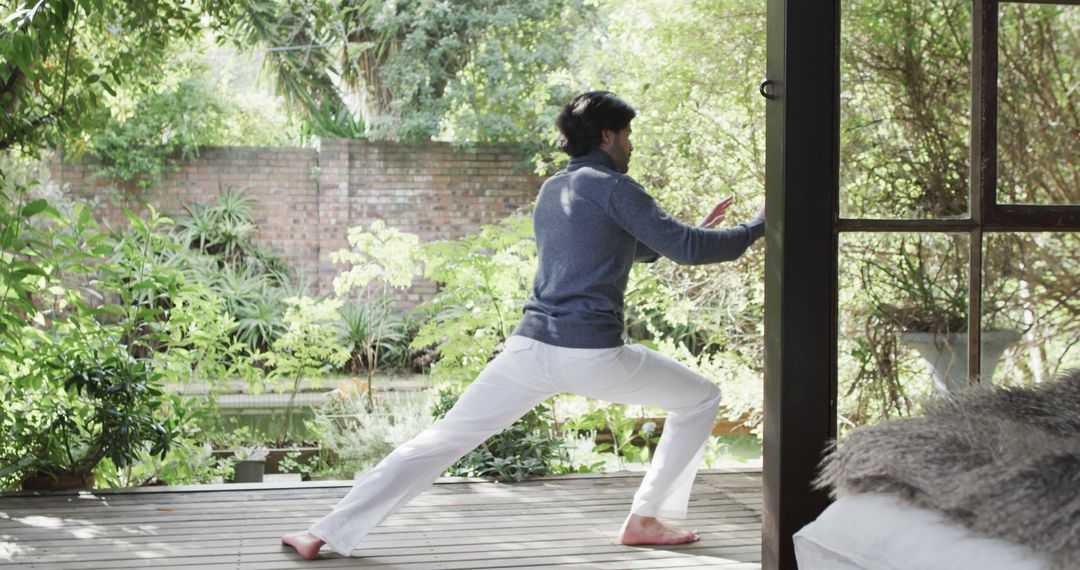 Man Practicing Yoga on Garden Patio - Free Images, Stock Photos and Pictures on Pikwizard.com