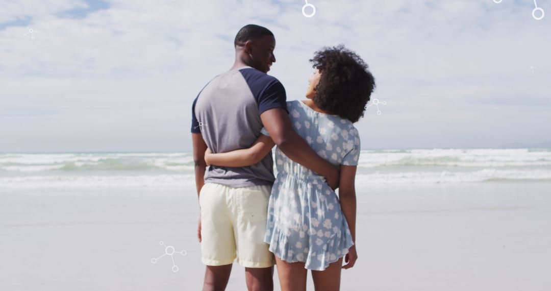 Couple Embracing at Beach with Molecular Design Overlay