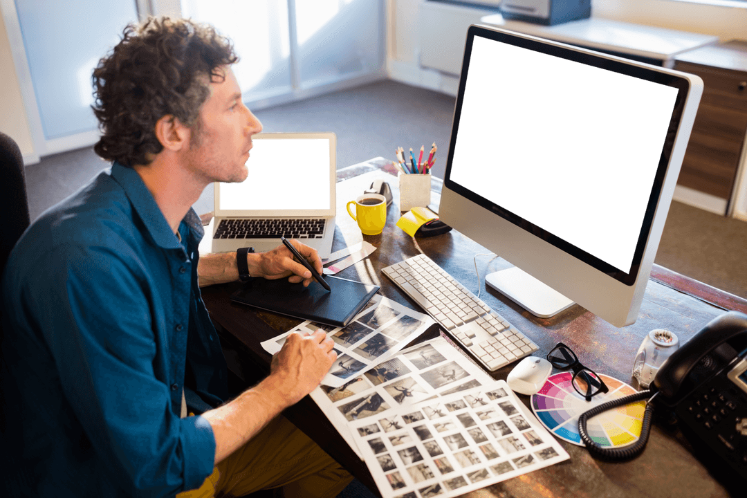 Transparent Creativity: Photographer Editing Images in Modern Office