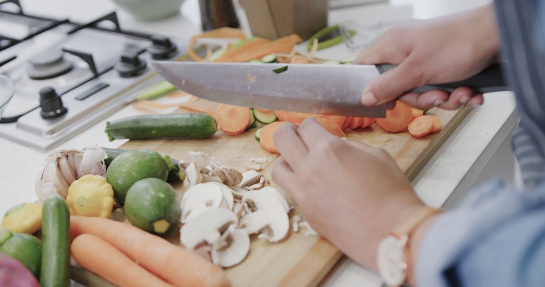 Close-Up of Person Chopping Vegetables in Modern Kitchen - Free Images, Stock Photos and Pictures on Pikwizard.com