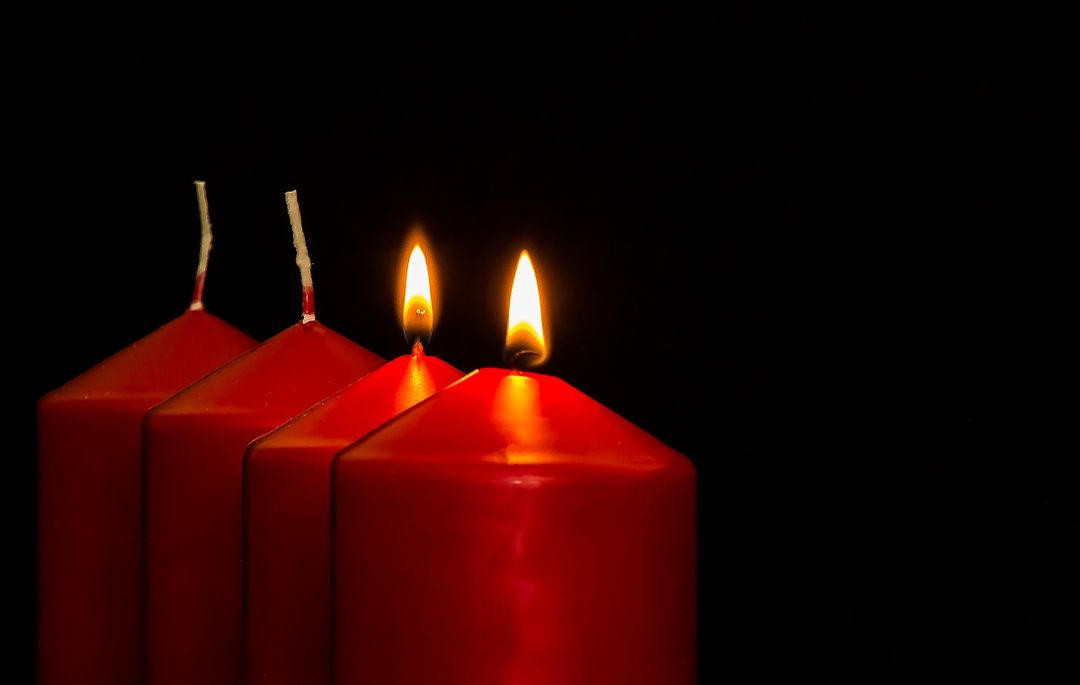 Close-up of Illuminated Candles over Black Background - Free Images, Stock Photos and Pictures on Pikwizard.com