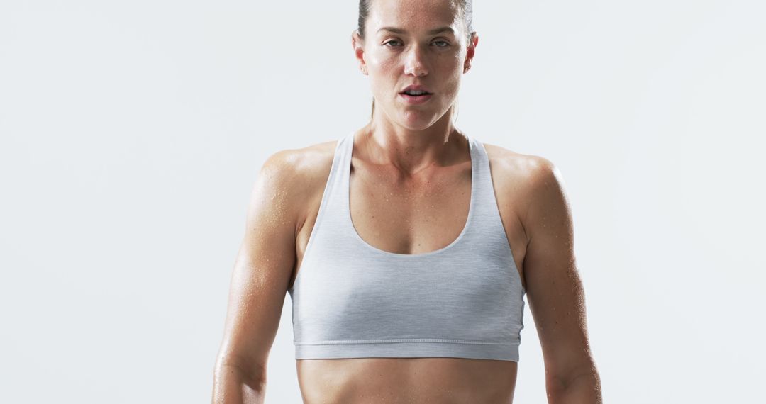 Determined Fit Woman Sweating After Intense Workout