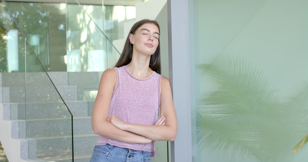 Relaxed Woman Standing with Eyes Closed at Modern Home