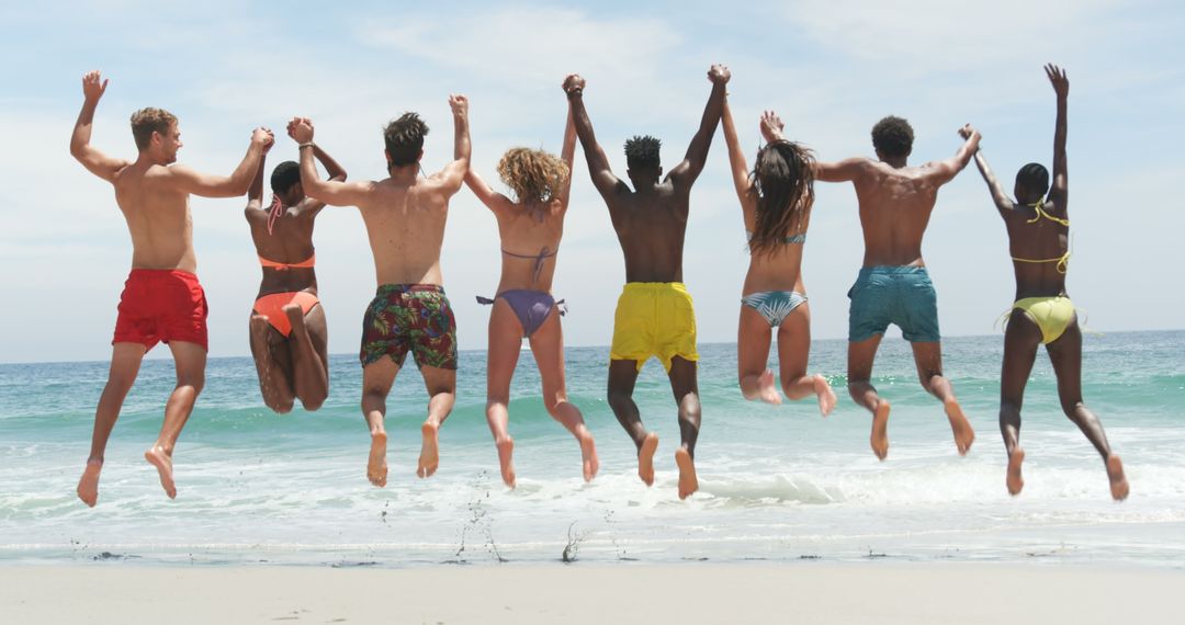 Diverse Group of Friends Enjoying Beach, Celebrating Summer Together