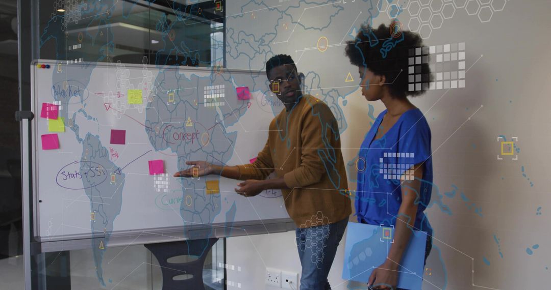 Professionals collaborating at whiteboard brainstorming global strategy with sticky notes