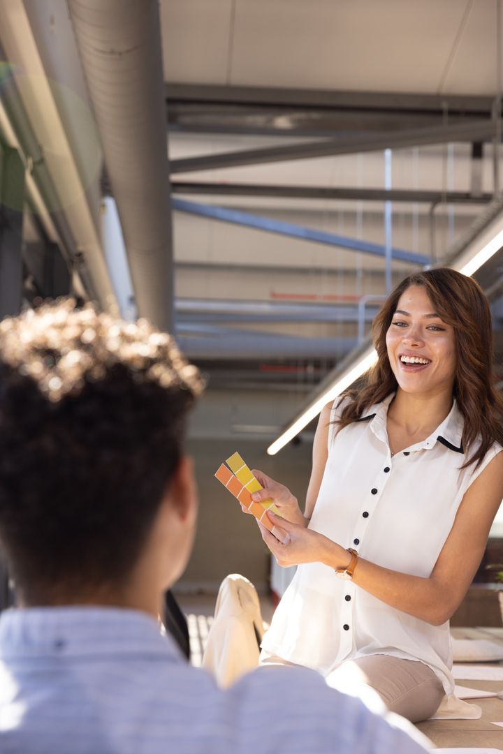 Coworkers Discussing Color Choices at Modern Design Studio