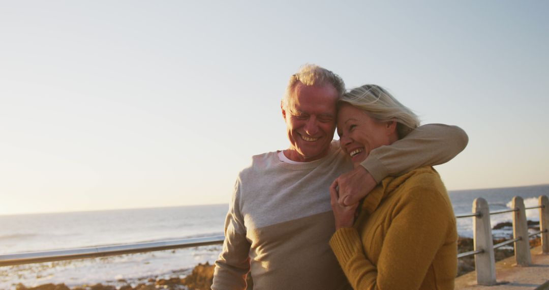 Happy Senior Couple Embracing at Sunny Seaside - Free Images, Stock Photos and Pictures on Pikwizard.com