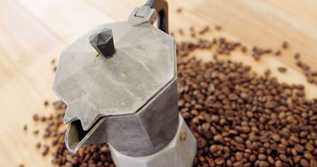 Vintage Coffee Percolator Surrounded by Roasted Coffee Beans on Wooden Surface - Free Images, Stock Photos and Pictures on Pikwizard.com