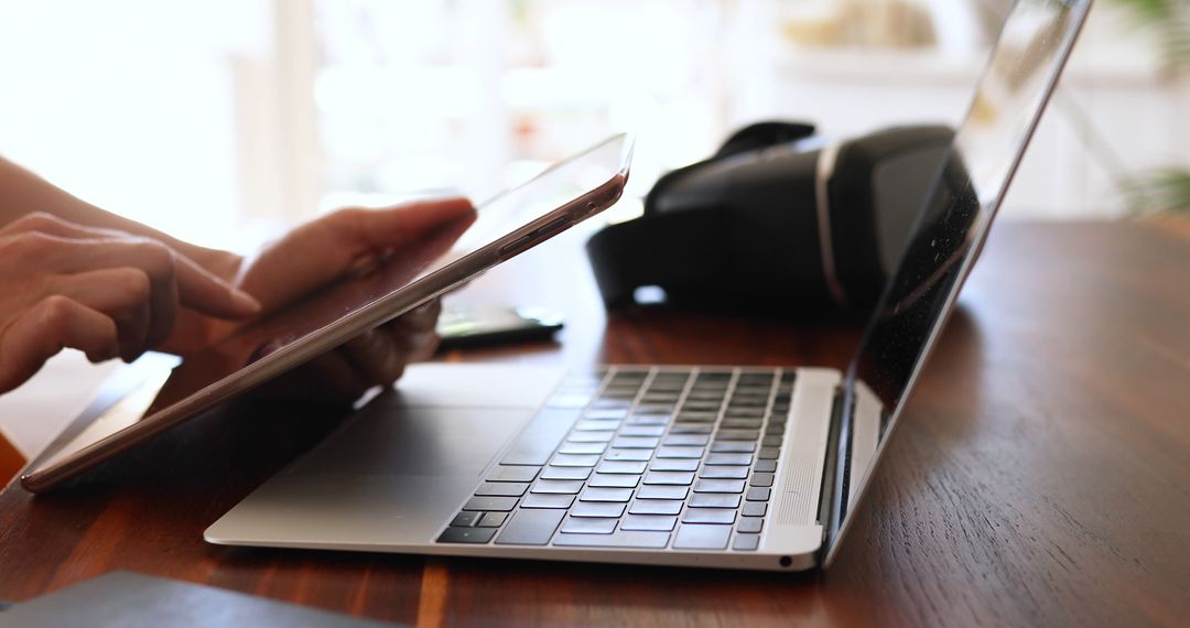 Remote Work Setup with Laptop Tablet and VR Headset