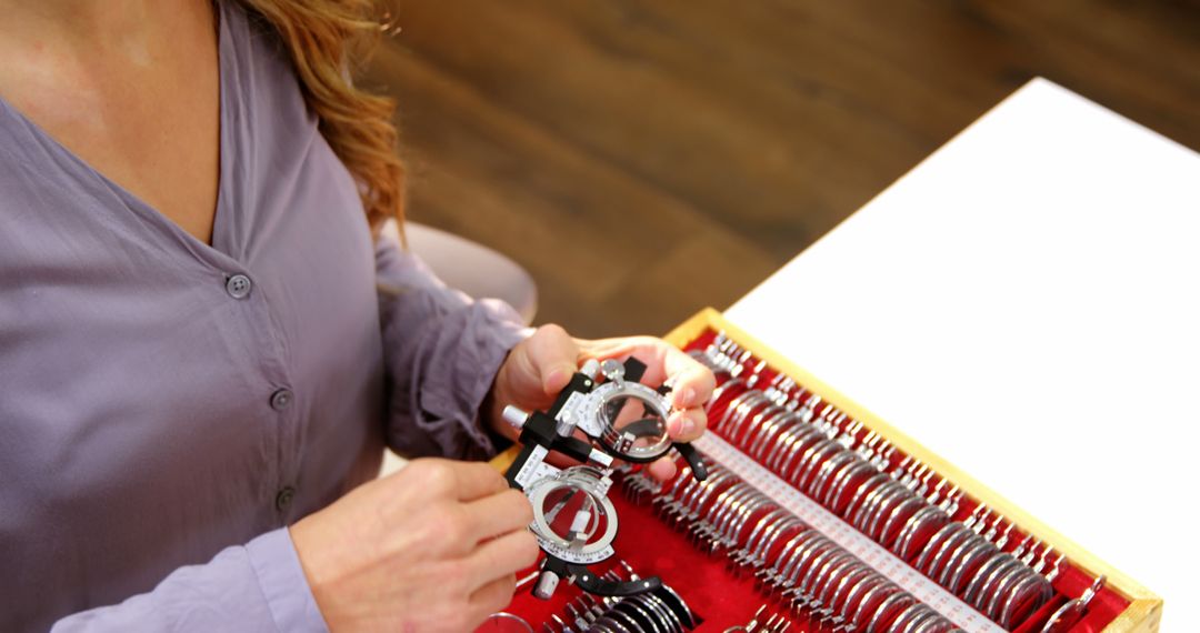 Optometrist Preparing Trial Lens Set for Eye Exam