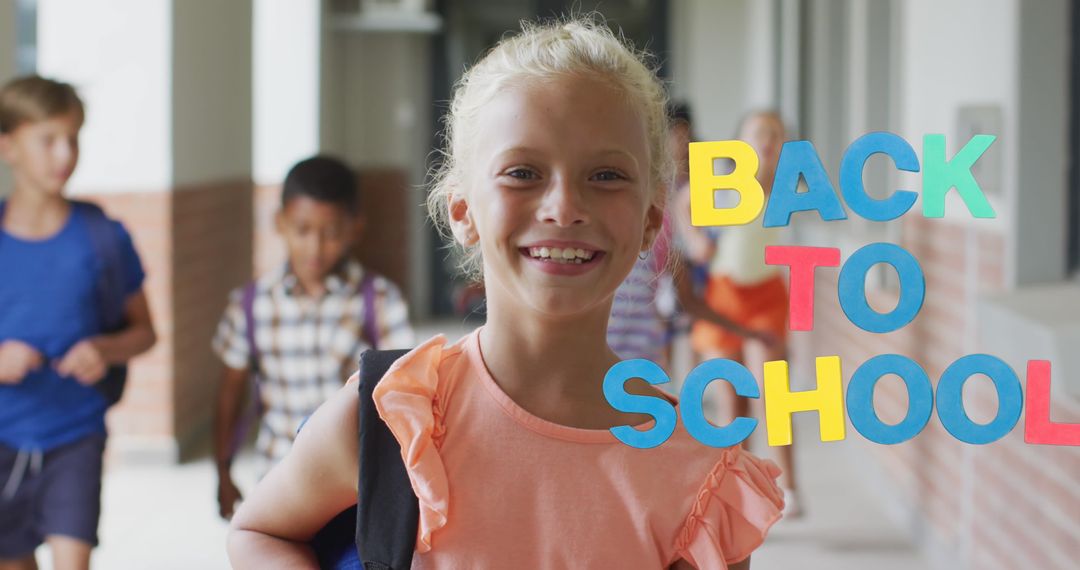 Smiling Schoolgirl Returning to School in Corridor