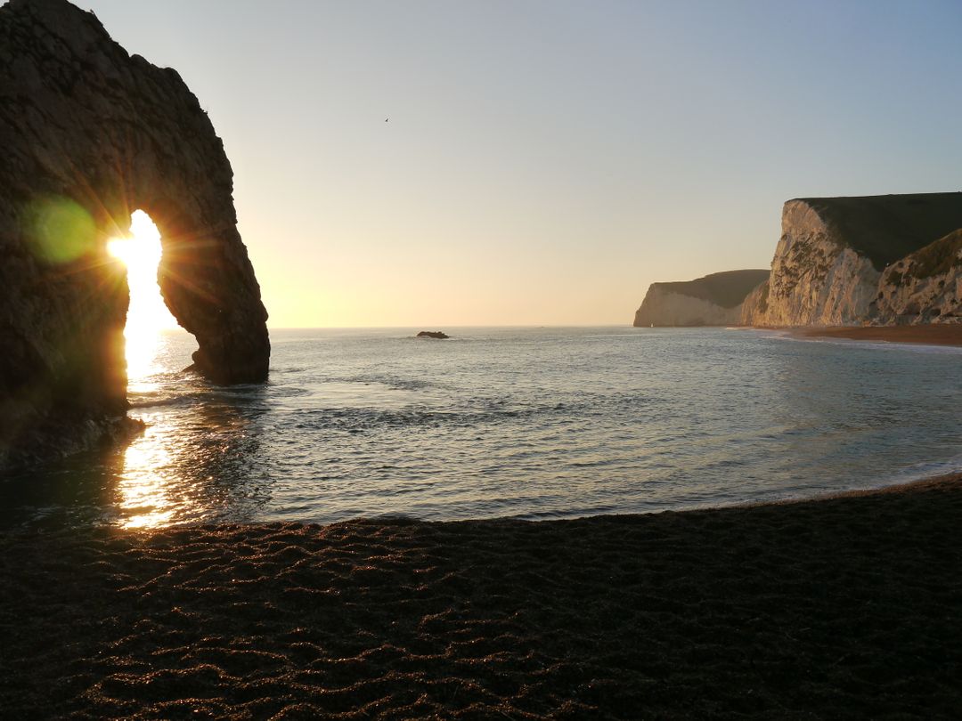 Sunset at Durdle Door on Dorset Coastline - Free Images, Stock Photos and Pictures on Pikwizard.com