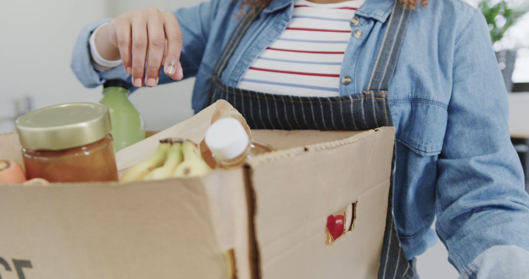 Woman Holding Box of Fresh Groceries at Home - Free Images, Stock Photos and Pictures on Pikwizard.com