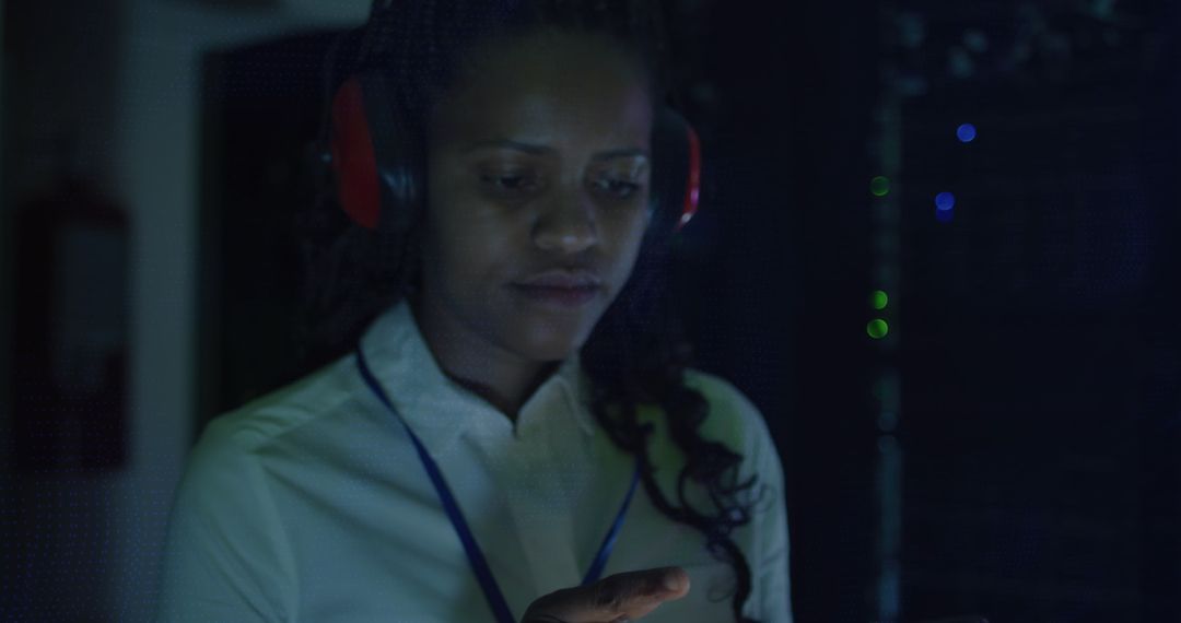 Woman Engaging with Technology in Server Room