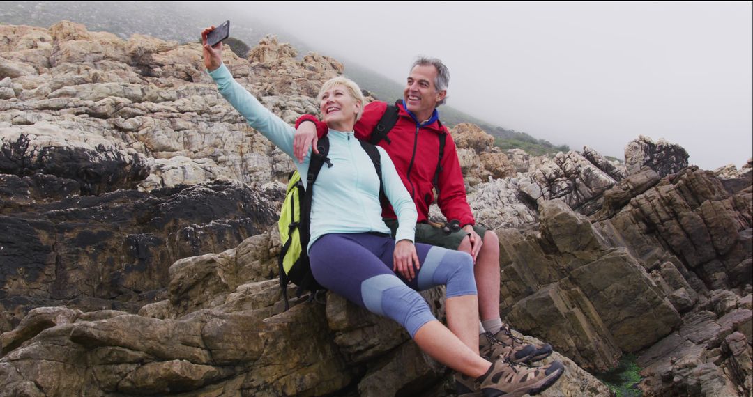 Senior Couple Taking Selfie During Seaside Hike