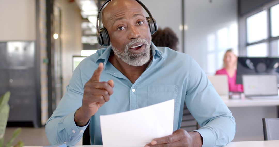 Focused African American Businessman Analyzing Document in Modern Office Setting