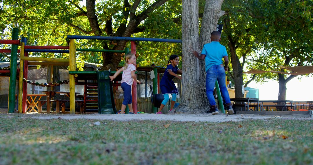 Children Playing in Park with Colorful Playground Equipment - Free Images, Stock Photos and Pictures on Pikwizard.com