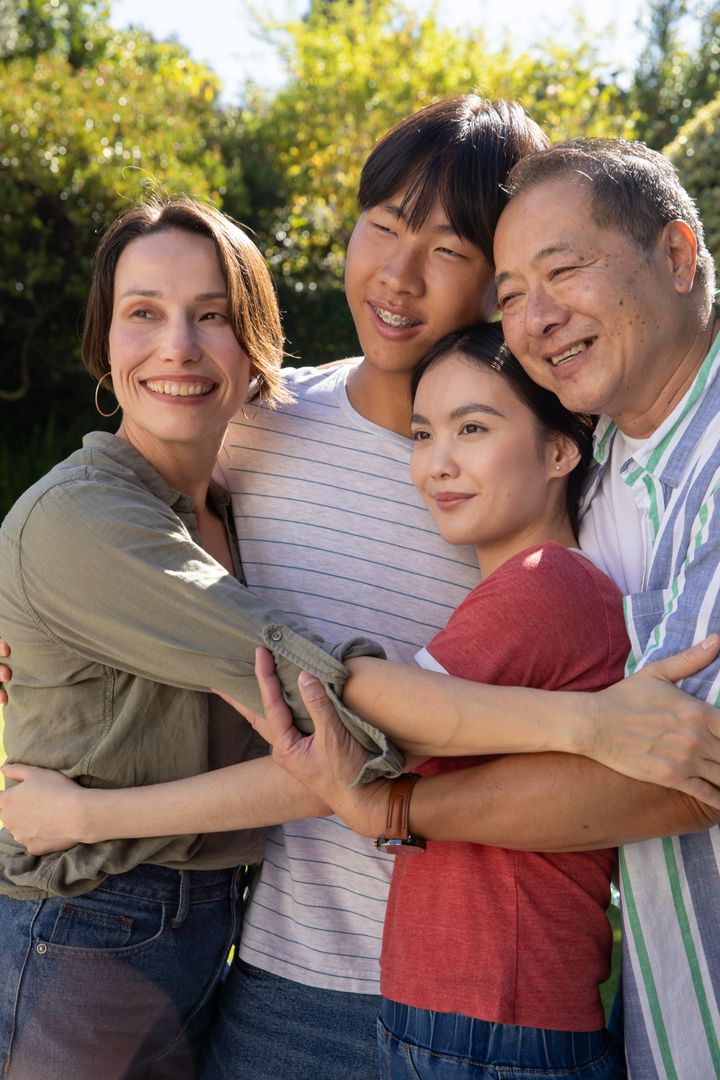 Happy Multigenerational Family Embracing in Lush Garden