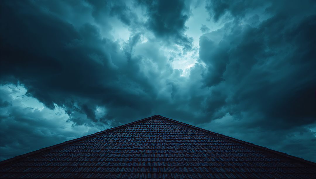 Dark Triangular Rooftop Under Stormy Skies