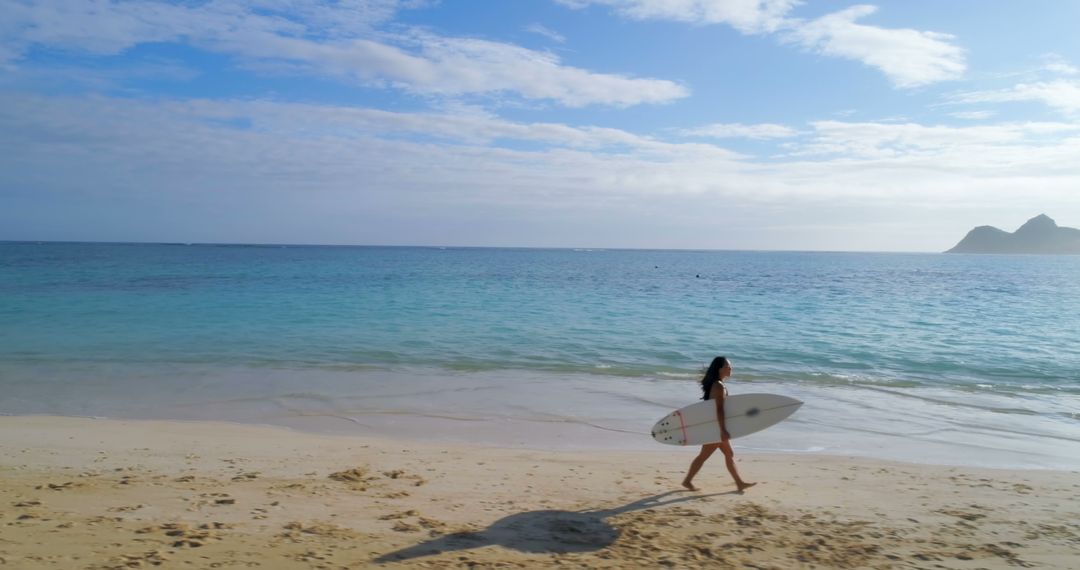 Woman Walking with Surfboard on Tropical Beach - Free Images, Stock Photos and Pictures on Pikwizard.com