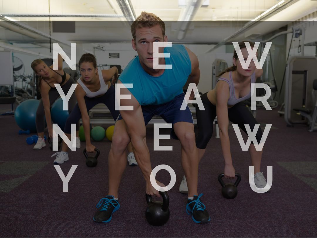 Diverse Group Focused on New Year Fitness Goals in Gym