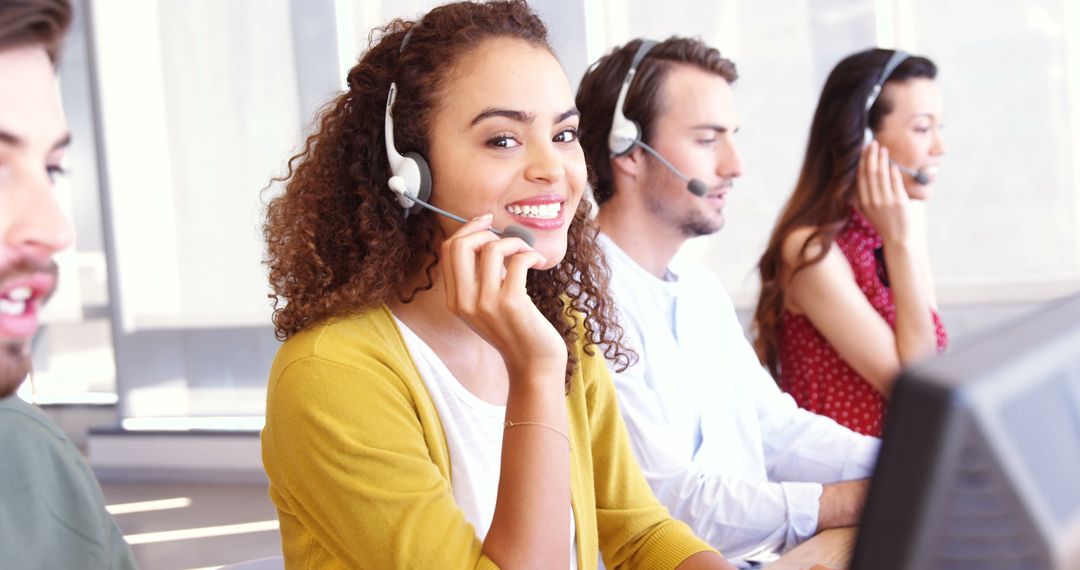 Diverse customer service team using headsets in modern office - Free Images, Stock Photos and Pictures on Pikwizard.com