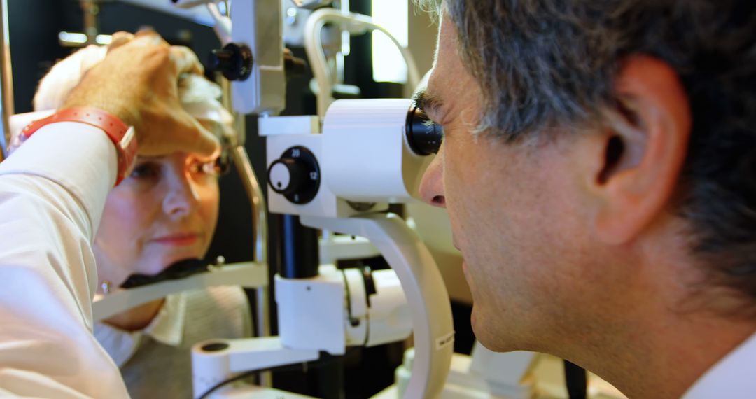 Optometrist Examining Senior Woman's Eyes During Eye Test - Free Images, Stock Photos and Pictures on Pikwizard.com