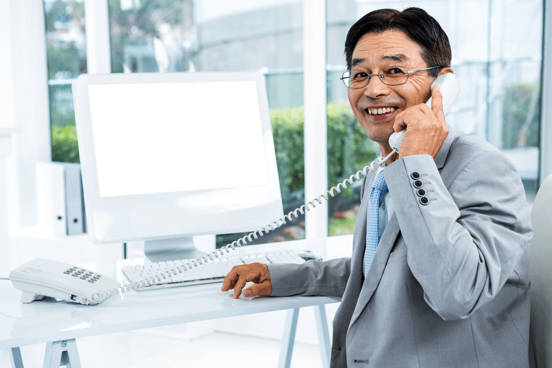 Smiling Businessman Holding Transparent Office Telephone