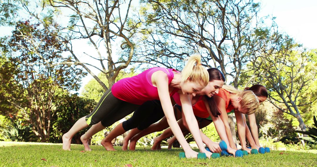 Women Engaging in Outdoor Fitness with Dumbbells in Park - Free Images, Stock Photos and Pictures on Pikwizard.com