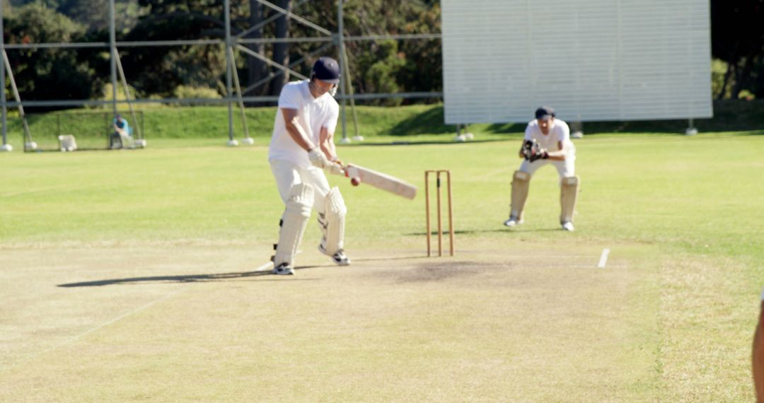 Batsman Playing Shot in Cricket Match on Sunny Day - Free Images, Stock Photos and Pictures on Pikwizard.com