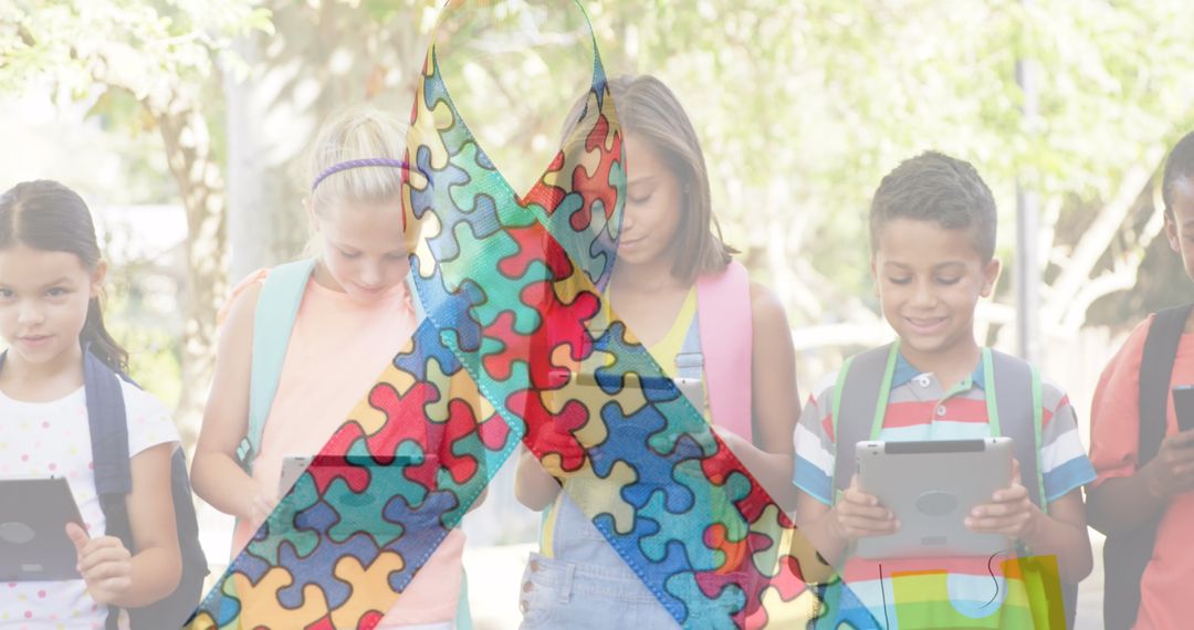Children Using Tablets with Autism Awareness Ribbon Overlay