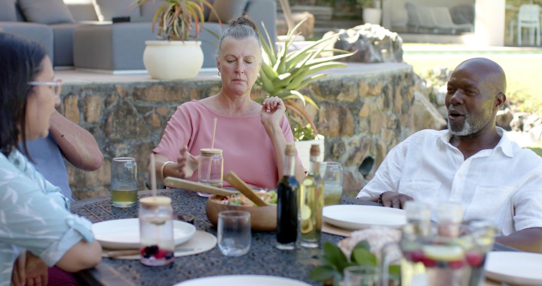 Diverse Friends Enjoying Al Fresco Dining with Salad
