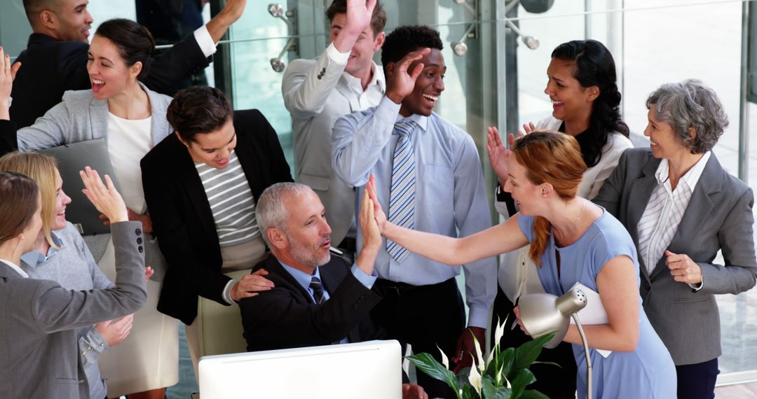 Multiracial Team Celebrating Successful Project with High Fives - Free Images, Stock Photos and Pictures on Pikwizard.com