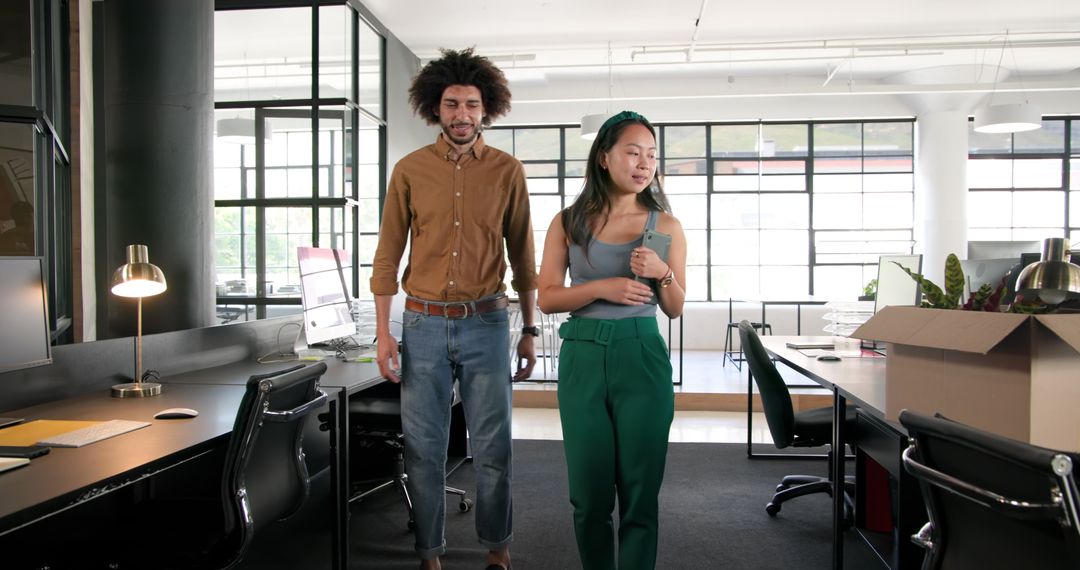 Diverse Colleagues Unpacking in Modern Office Environment