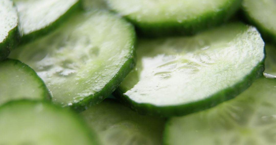 Close-up view of fresh cucumber slices arranged on a surface, with copy space - Free Images, Stock Photos and Pictures on Pikwizard.com