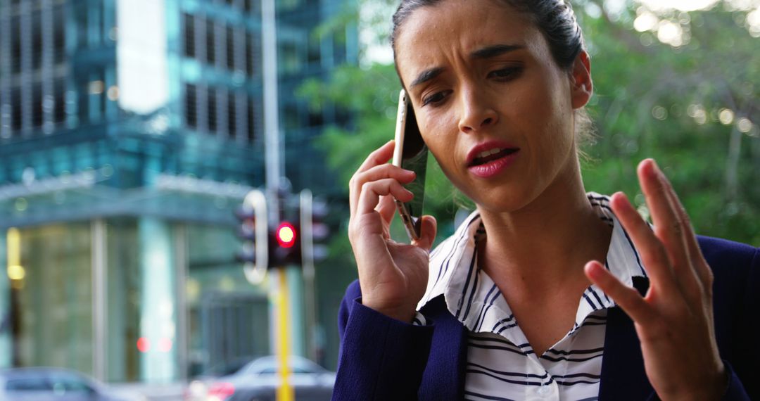 Stressed Businesswoman Talking on Phone Outdoors in City - Free Images, Stock Photos and Pictures on Pikwizard.com