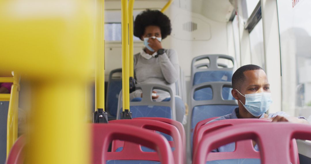Commuters Wearing Masks Social Distancing on City Bus during Pandemic