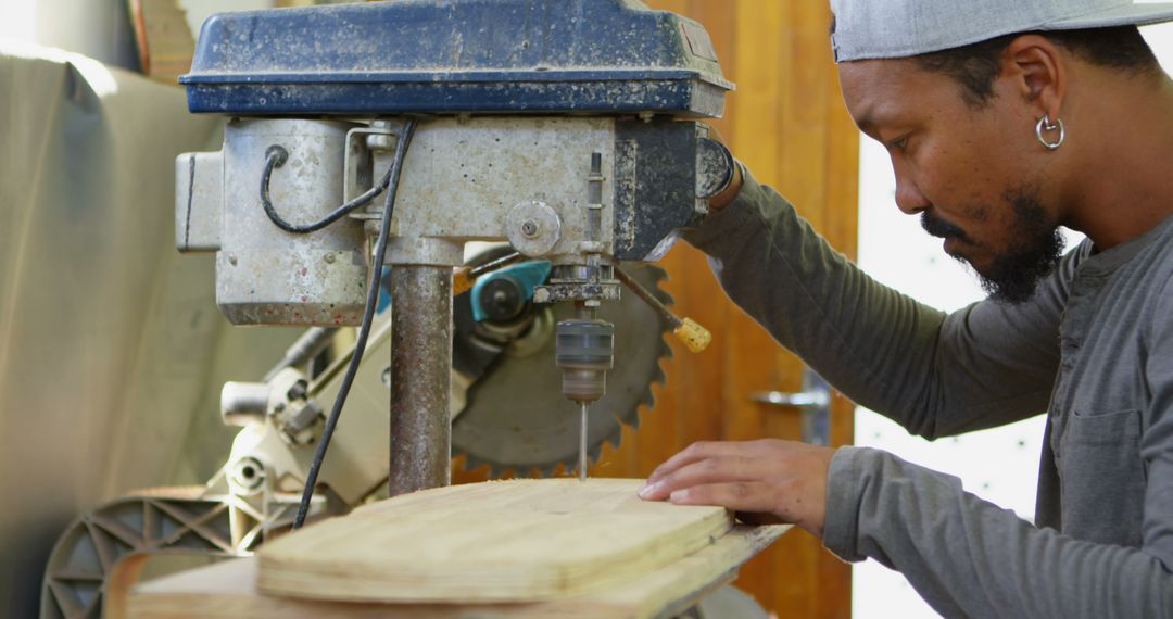 Man Operating Drill Press in Woodworking Workshop - Free Images, Stock Photos and Pictures on Pikwizard.com