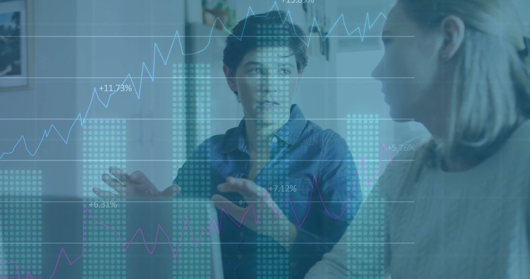 Business Colleagues Analyzing Data with Overlay Charts in Office