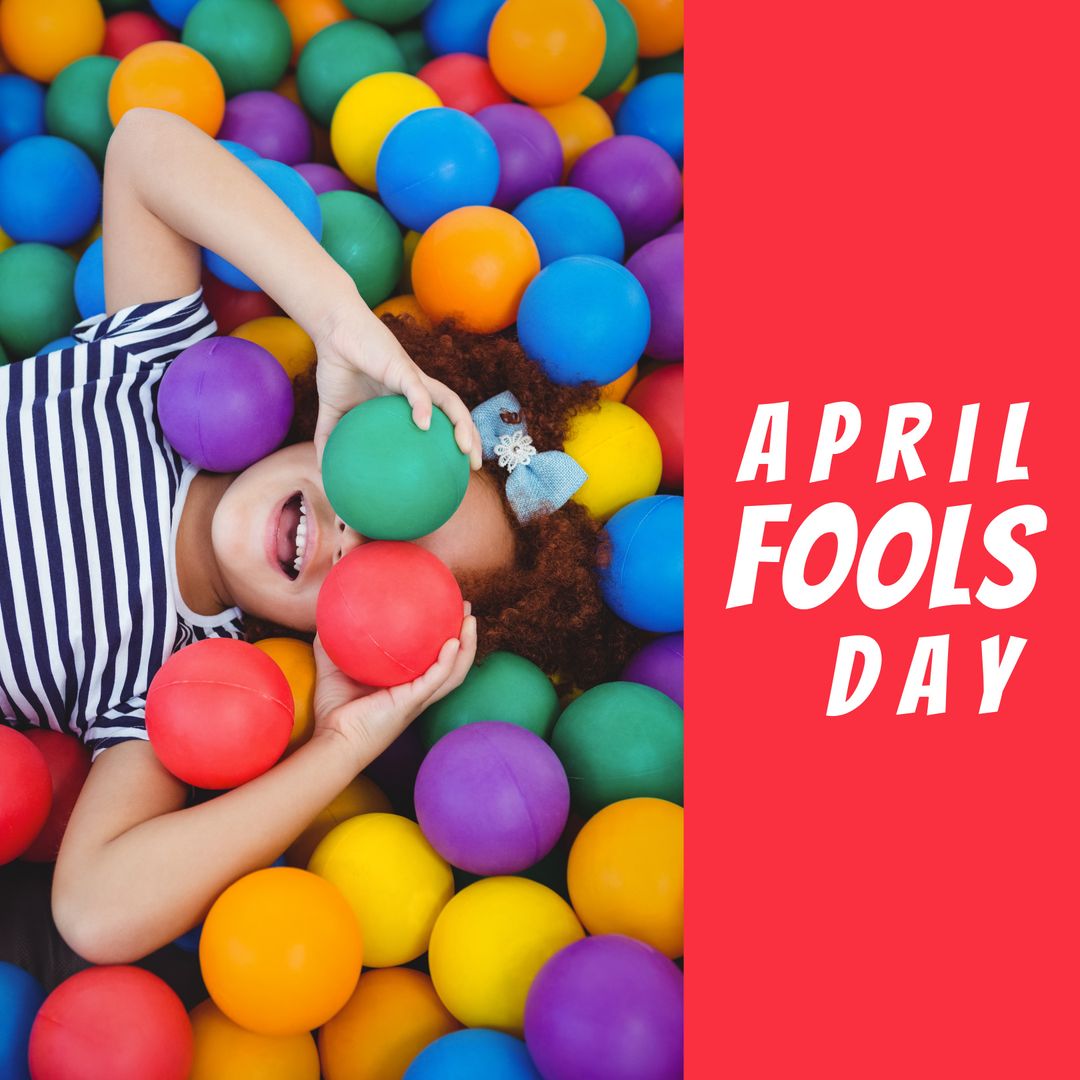 Joyful Child Celebrating April Fools Day in Ball Pit