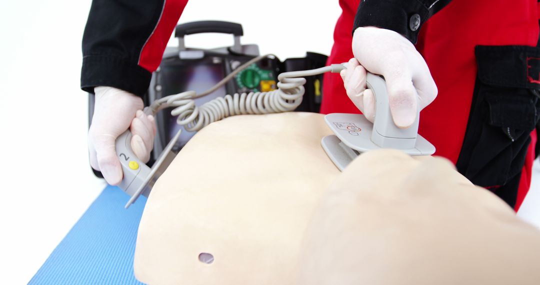 Paramedic Using Defibrillator on Training Dummy - Free Images, Stock Photos and Pictures on Pikwizard.com