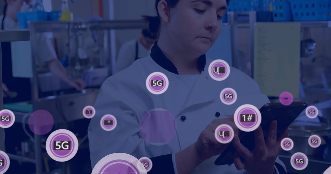 Chef Using Tablet with 5G Technology Overlay in Kitchen