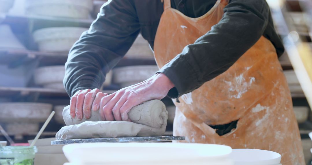 Potter Kneading Clay in Studio - Free Images, Stock Photos and Pictures on Pikwizard.com