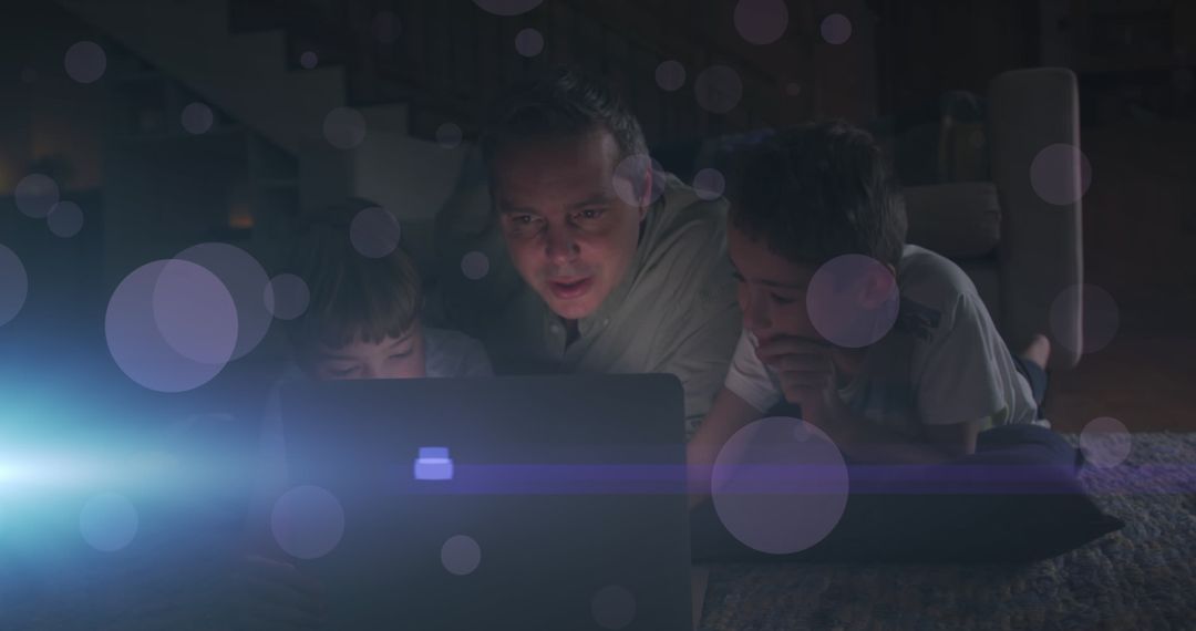 Father and Children Enjoying Laptop Time with Digital Lights