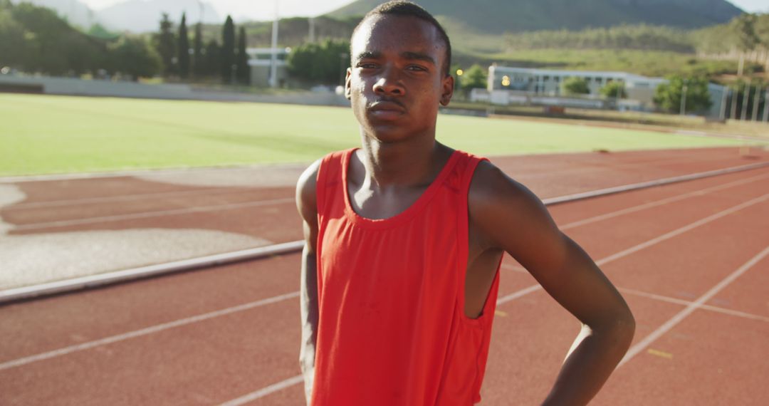 Determined Athlete in Training Posing on Track