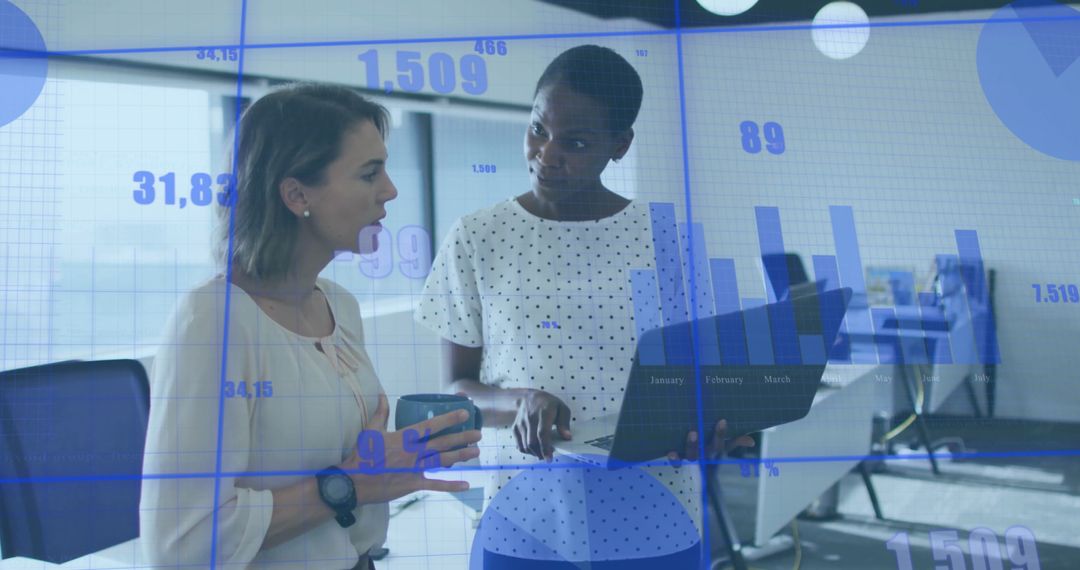 Women Discussing Business Analytics in Modern Office