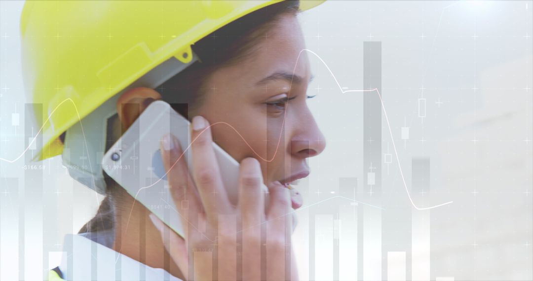 Profile of Asian Female Engineer Talking on Phone with Overlay of Data Graphs