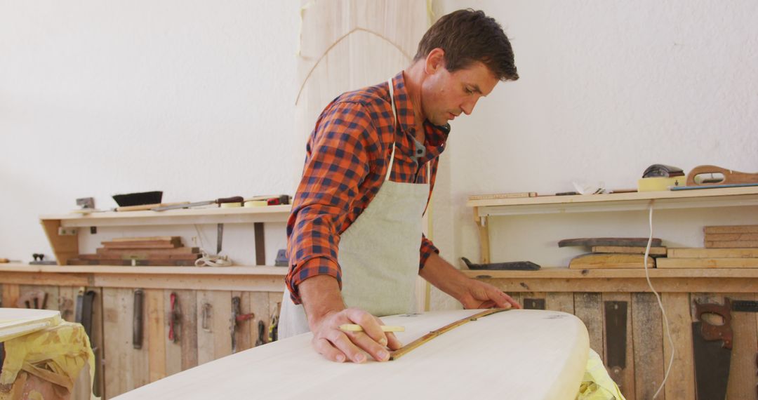 Carpenter Crafting Wooden Surfboard in Workshop - Free Images, Stock Photos and Pictures on Pikwizard.com