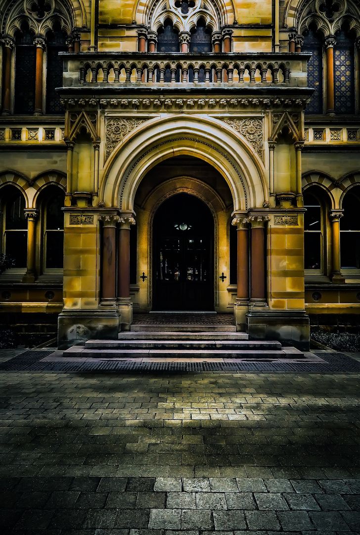 Illuminated Gothic Building Entrance at Night