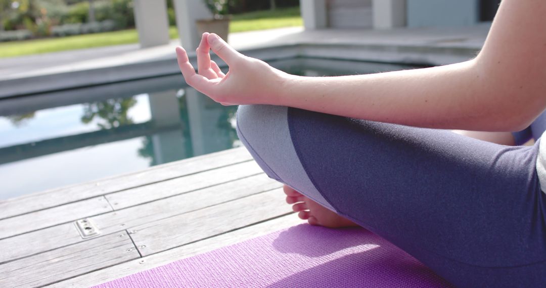 Person Meditating Near Pool in Relaxing Outdoor Setting - Free Images, Stock Photos and Pictures on Pikwizard.com